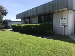 A facility from the outside on a lear sunny day.